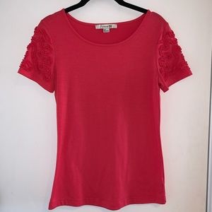 Never worn! Coral top with design on sleeves